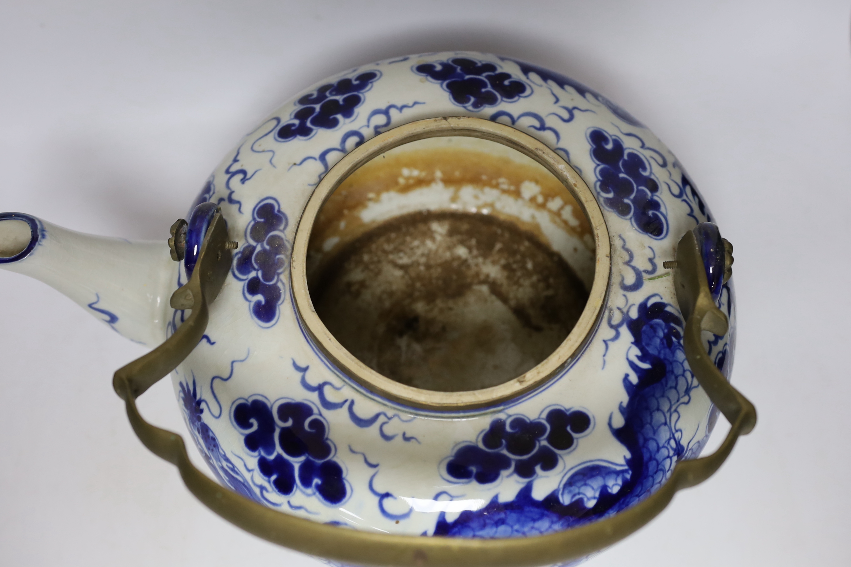 A large Chinese blue and white ‘dragon’ teapot, 38cm wide